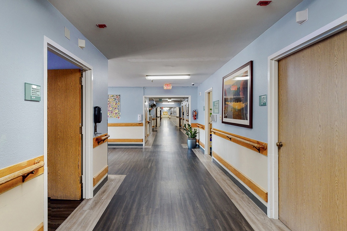 Peninsula Post Acute hallway with wooden floors
